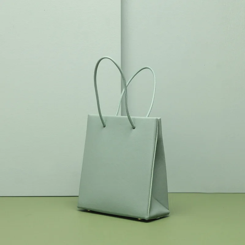

New 2019 summer casual leather retro lady's bag pure color drawstring shopping bag small square bag