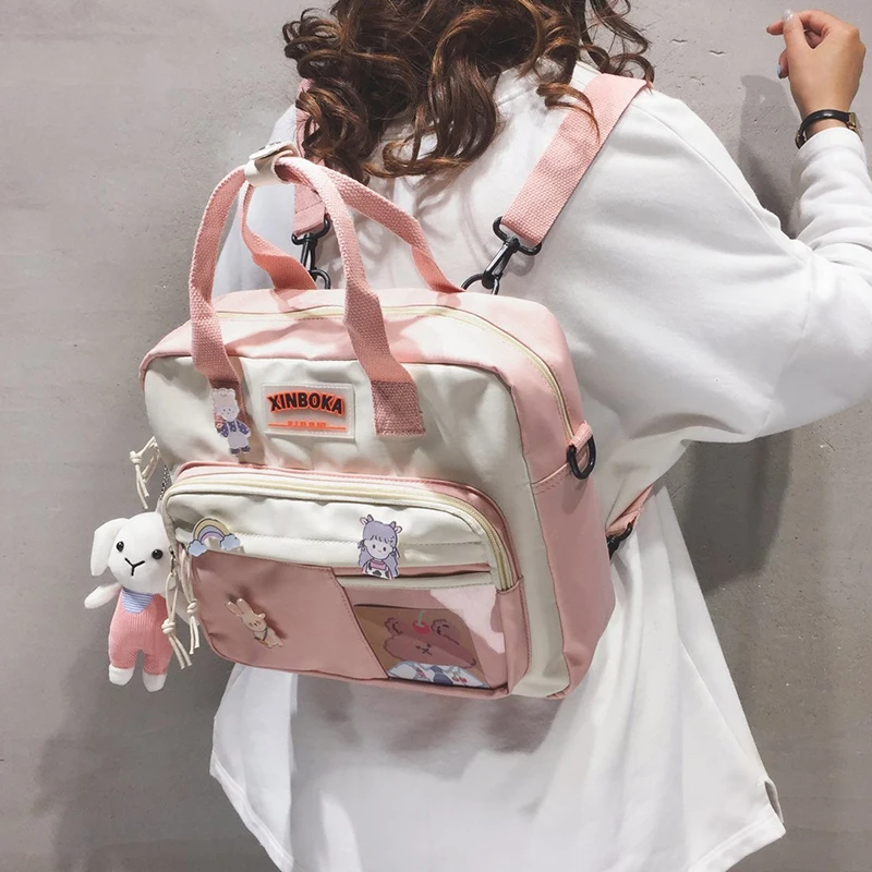 Mochila Kawaii de nailon para mujer, morral escolar con insignia bonita, bolso de hombro a la moda, 2021