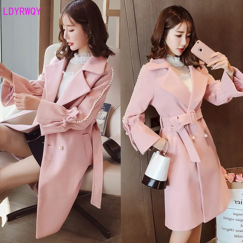 

2019 autumn and winter new women's Korean version of the lapel fashion trumpet sleeve stitching pearl tie belt waist woolen coat