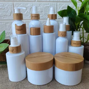 Eco friendly Refillable Serum Bottles frosted /white/clear plastic bottles Treatment Pump bamboo cap spray lotion pump bottles