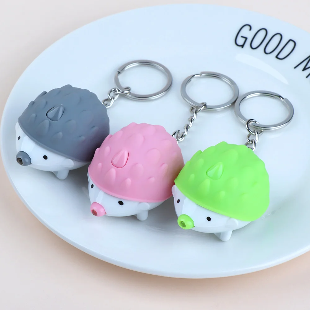 

Cute Hedgehog LED Key Chain Mini Flashlight Luminous Key Ring Bag Pendant Kids Toy Gift Women Party Jewelry