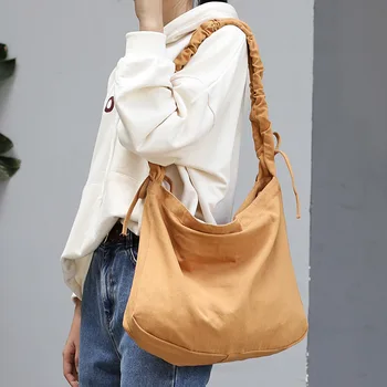 

Korean version of the simple canvas shoulder bag female fashion fold belt tote bag casual Hong Kong style crossbody bag