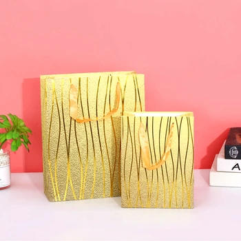 

Golden gift bag with gilding stripes, for Birthday wedding, Christmas, graduation, baby shower gift bag