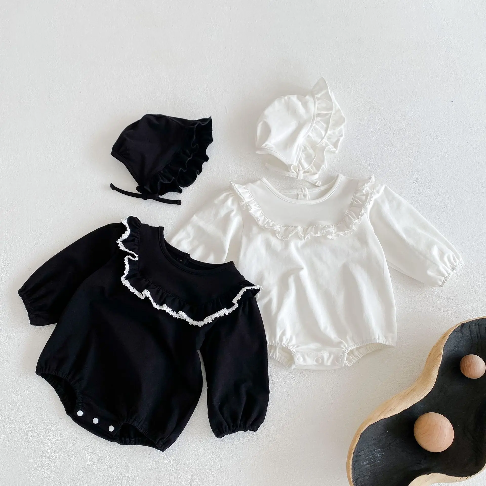 Hot selling baby girls 2021 babies' 100-day clothes ruffled collar lace pure color long-sleeved romper triangle jumpsuit black baby bodysuits	