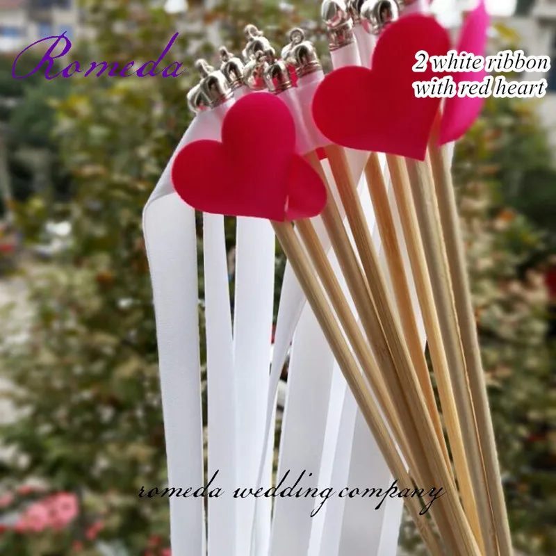 white ribbon with red heart