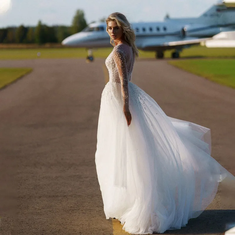 

Прозрачные иллюзионные свадебные платья, дизайн 2022 с жемчугом, органза с длинными рукавами, а-силуэт, индивидуальный пошив, круглый вырез, очаровательные женские платья со шлейфом