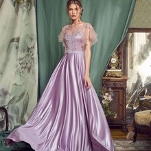 Jasnofioletowe suknie wieczorowe satynowe aplikacje koraliki formalne na imprezę bal suknia dla kobiet z paskiem Sheer O-Neck Backless piętro długość