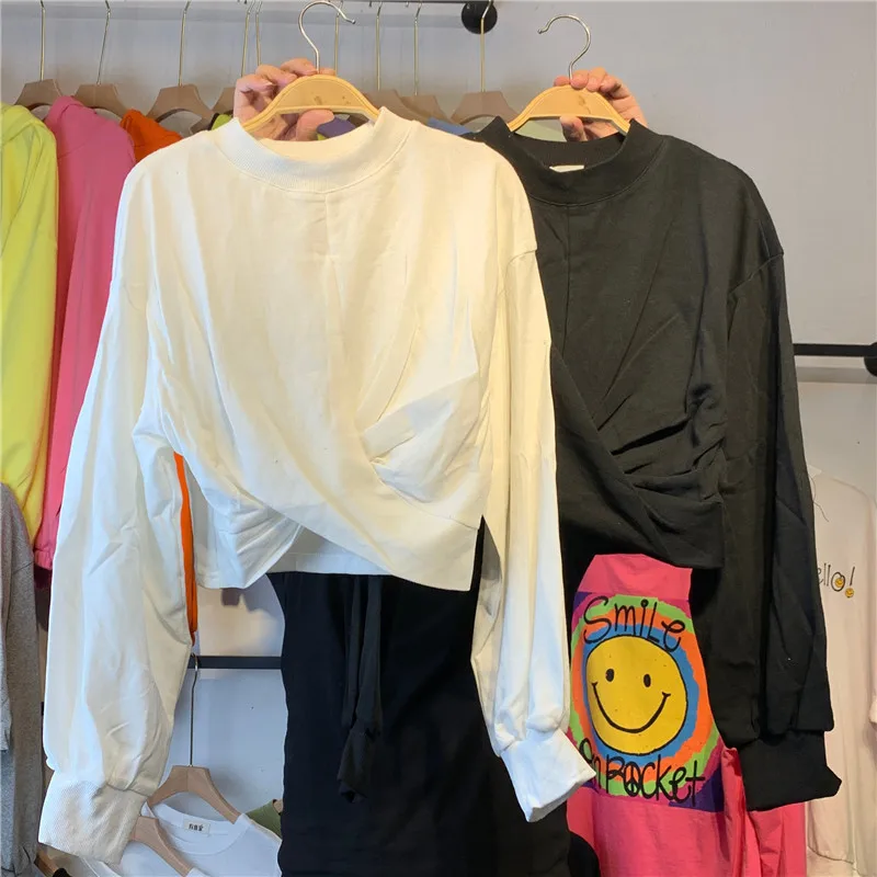 

2020 Spring and Autumn New Thin Solid Color Round Neck Sweater Women's Irregular Short Loose Bottoming Shirt