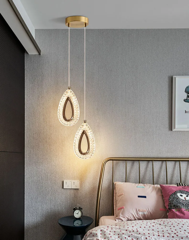 Name: Water drop indoor pendant lightLight color: white light (above 6500k), natural light (4000-6000k), warm light (2200-3500k)，"3 light colors" means that it can be switched between white light, warm light and natural light.Lampshade/Shell color: Acrylic lampshade/Golden lamp bodyMaterial: Acrylic + AluminumDimensions: 23 x 13 x 4 cmCable length: 2 metersInput voltage: 90V-220VWorking power: 8W • Colma.do™ • 2023 •