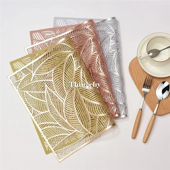 

PVC Pressed Leaves Gold Plastic Placemats for Kitchen Dining Table Decorative Floral Table mats for Decoration