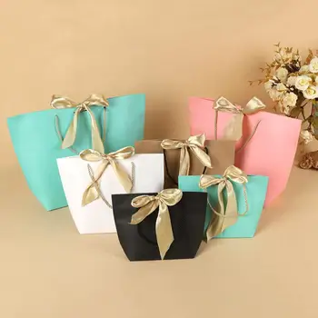 

Elegant Celebration Cardboard Present Wrap Paper Gift Bag Boutique Clothes Packaging Bags with Bow Ribbon LX8555