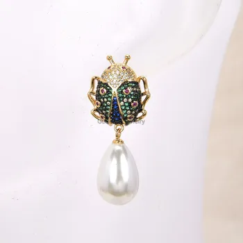 

GG Jewelry White Sea Shell Pearl Yellow Gold Plated CZ Beetle Earrings