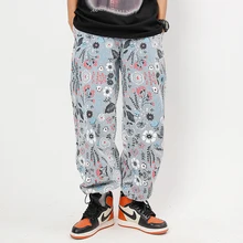 Pantalones vaqueros rasgados de pierna ancha para hombre y mujer, ropa de calle recta, holgados, de gran tamaño, con estampado de flores de Color Hip Hop