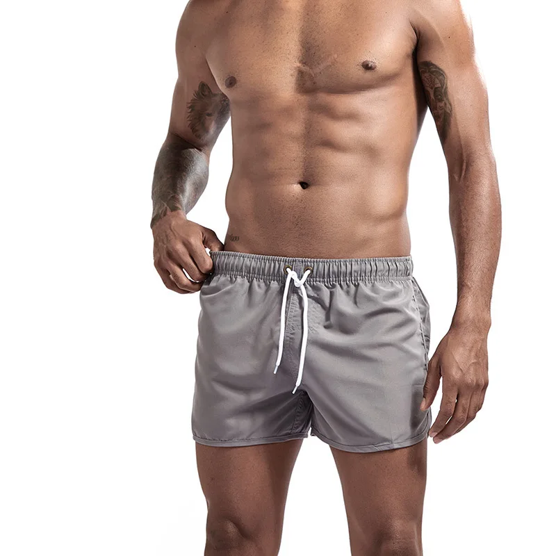 Летние новые шорты для фитнеса пляжные мужские повседневные быстросохнущие шорты черные белые шорты бермуды с завязками на талии для мужчин размера плюс - Цвет: Gray