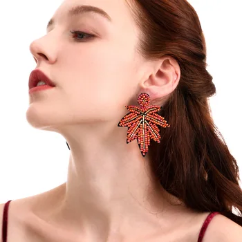 

Bohemian maple leaf resin bead earrings female designer color bead hand-dropped temperament set-piece earrings