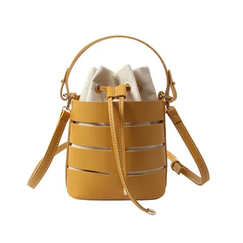 

2020 summer new round women handbag hollow PU material small bag of lady Portable bucket bag casual lady shoulder Messenger bag