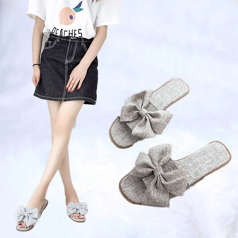 

Summer New Sandals Female 2019 Bow Sandals And Slippers Ladies Korean Version Of The Flat-Bottomed Word Explosions Women'S Shoes