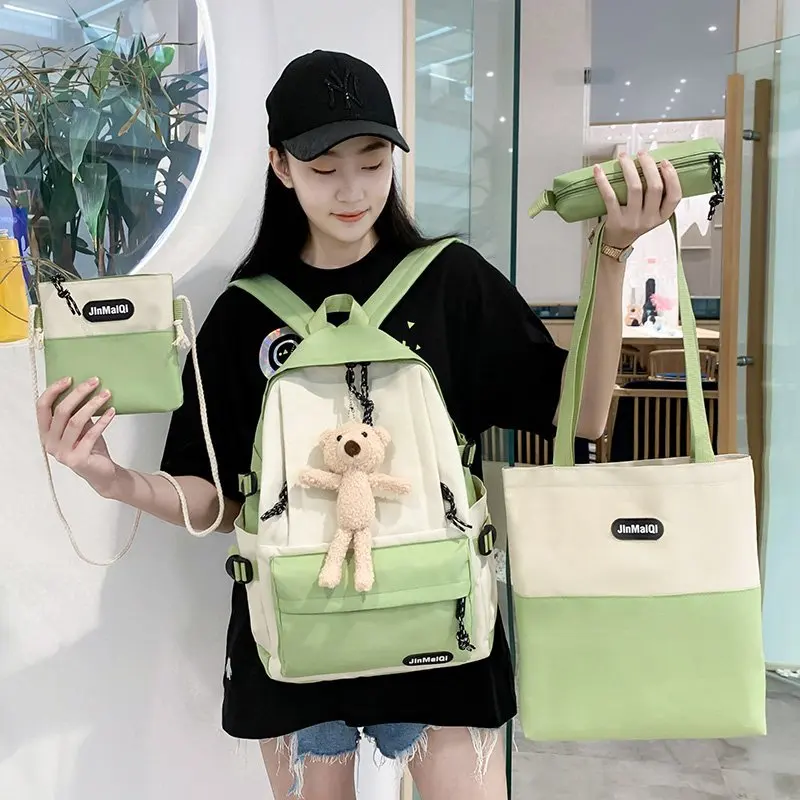 

Men's and women's four piece backpack Korean schoolbag Multi Pocket fashion schoolbag for primary and secondary school students