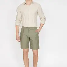 Koton мужские зеленые шорты 9YAM44118OW