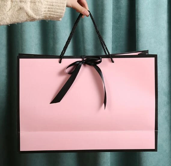 Bolsa de papel creativa para tienda de ropa, bolso de mano con lazo, bolsa  de regalo rosa, logotipo personalizable - AliExpress