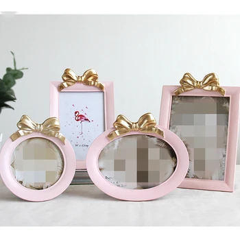 

Cute Style Photo Frame Bowknot Decor Picture Frames 4/5/6/7/8 Inch Resin Frame Cadre Photo Round Oval Rectangle Shapes 3 Colors