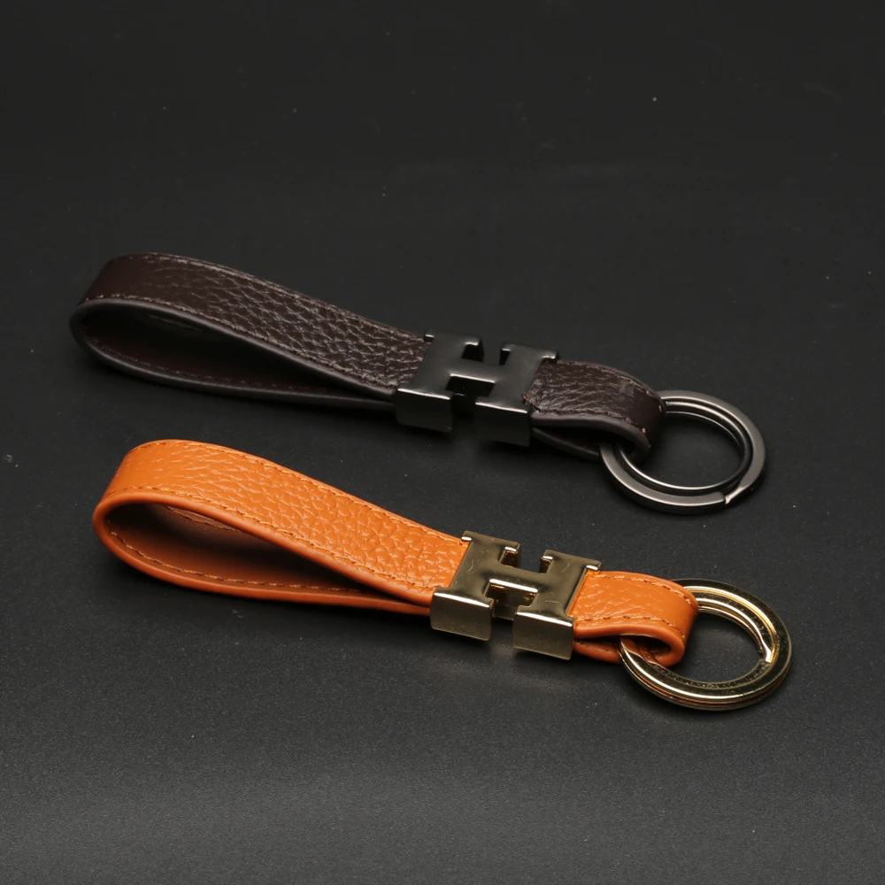 

Leather keychain key rope anti-lost double buckle metal handmade creative pendant key bag gift giveaway