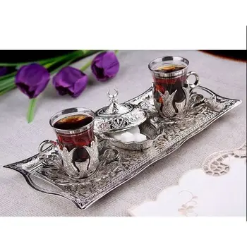 

Turkish Silver teaset for two personalityNinepiece silver Turkish tea glass set and sugar bowl and rectangular presentation tray