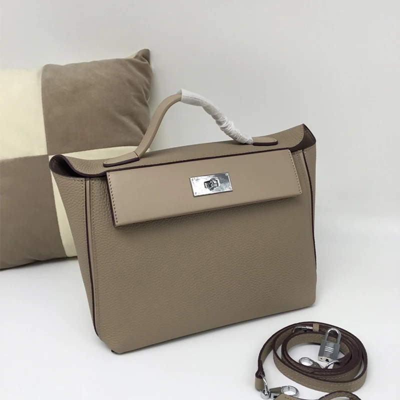

Leather handbag Kel 24/24 wings Baotou layer cowhide 2019 new version of the shoulder Messenger bag female dumplings package