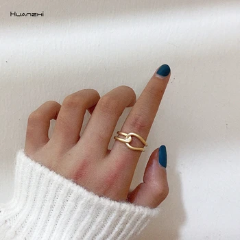 

HUANZHI 2020 New Cross Distortion Double Layer Hollow Out Geometric Irregular Golden Ring For Women Party Jewelry Gift