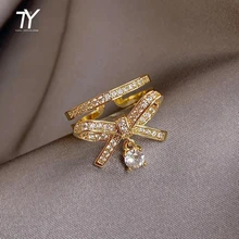 Luksusowe błyszczące cyrkonie łuk podwójne złote pierścienie otwierające dla kobiety biżuteria koreańska akcesoria gotyckie dziewczęcy niezwykły zestaw pierścieni tanie tanio Taoya CN (pochodzenie) Mosiądz Kamień półszlachetny Klasyczny Zestawy ślubne Kokardka Wysadzany moda Na imprezę Pierścionki