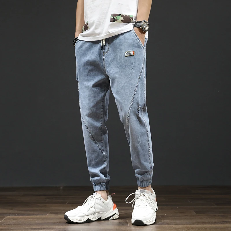 Spring / summer 2020 new legged pants Korean Trend loose and versatile elastic legged Harlem jeans men's fashion brand Spring / summer 2020 new legged pants Korean Trend loose and versatile elastic legged Harlem jeans men's fashion brand