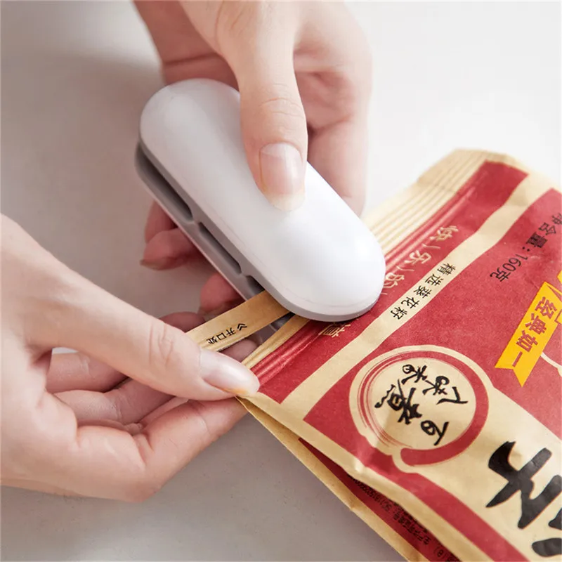 

Household Appliances Mini Heat Sealing Machine for Bags Handy Heater Package Sealer Clamps for Kitchen Packing Machine for Food