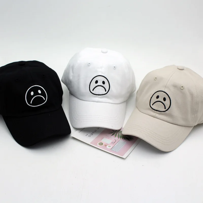 

The new summer 2020 version of the Korean version of joker cry face embroidered baseball cap sad boys letter sun shade cap