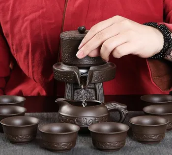 

Purple clay stone grinding semi-automatic Tea Set,creative Kung Fu tea Hot sales of tea set.Creative Tea ceremony supplies