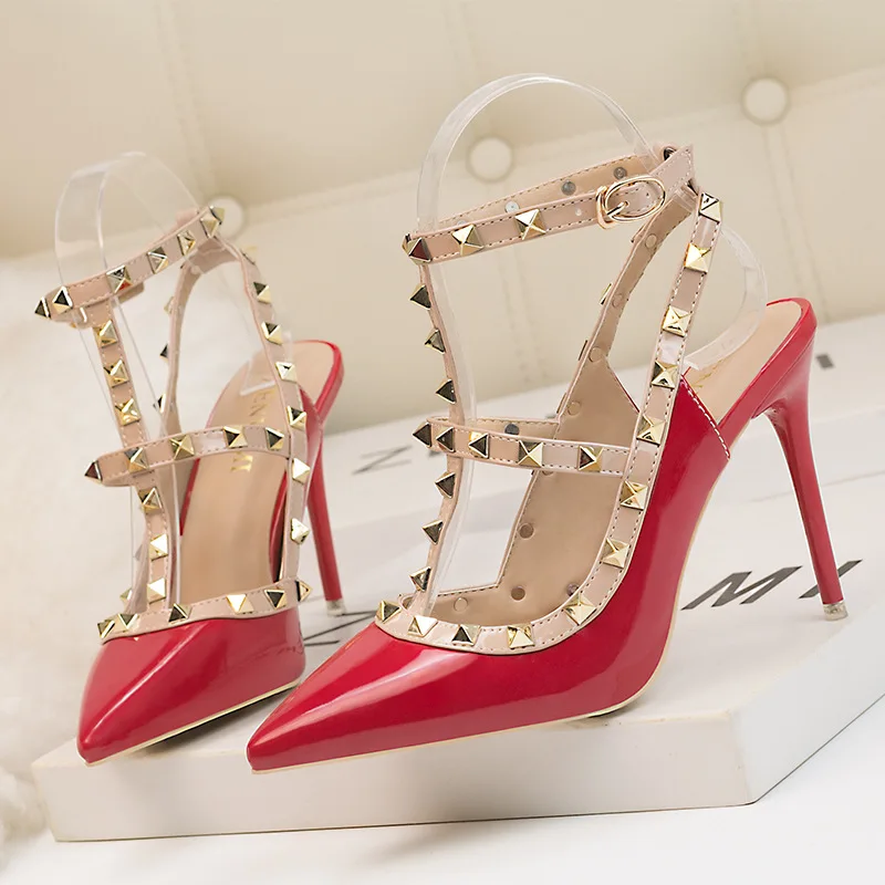 

Thin heel pointed high-heeled shoes patent leather solid color rivet Roman hollow sandals female