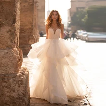 

Princess Luxury Wedding Dress Tulle With Ruffles Tiered Modest Bridal Gown Button Back Sleeveless Beading Floor Length Vestidos