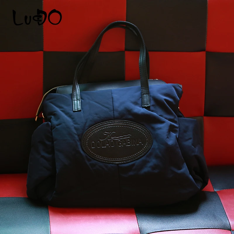 Beste 2019 Nieuwe Winter Vrouwen Handtassen Dames Warm Tote Tas Mode Ruimte Katoen Materiaal Grote Pakket Down Jas Zak Sac EEN belangrijkste Bolsa