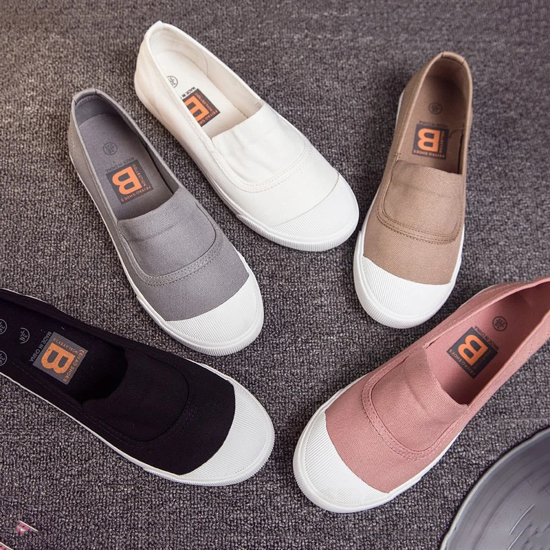 white canvas boat shoes