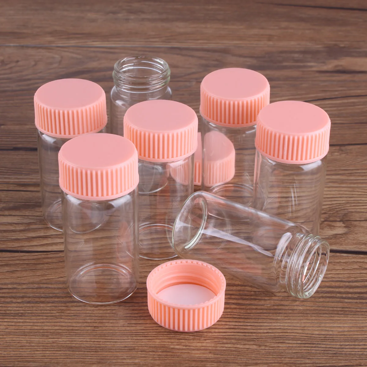 https://ae01.alicdn.com/kf/H99cbedfe4e884bbbb91b0f0fb2c329a9e/5pcs-25ml-30-60mm-Glass-bottle-with-Pink-Plastic-Lids-Potion-bottles-Glass-Jars-Glass-Vials.jpg