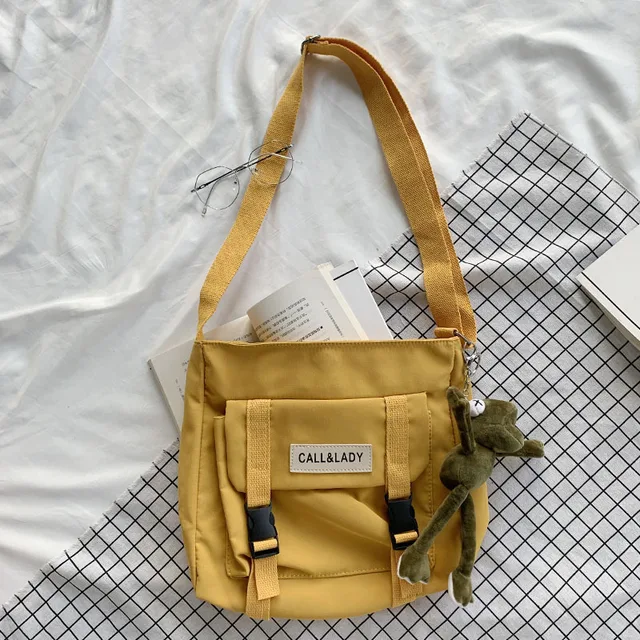 Fashion Classic Simple Messenger Bag Women's South Korea Chic Postman Bag Lady Student Nylon Waterproof Canvas Schoolbag Frog pendant