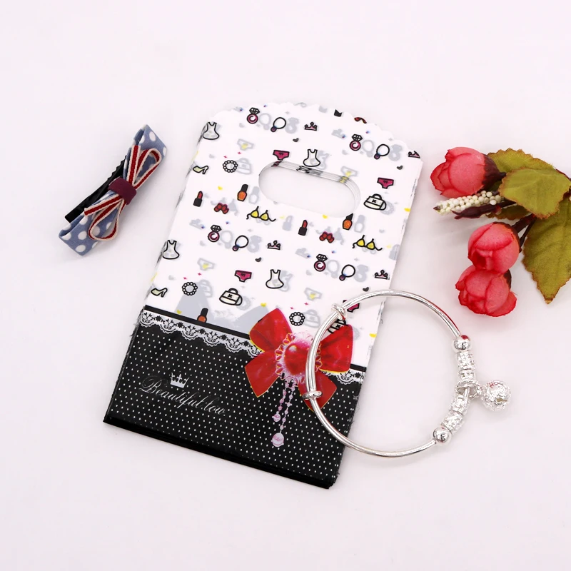 

50pcs/lot Red Bow Printed Plastic Bags with Handles 9x15cm Cheap Boutique Gift Packaging Bag Soap Storage Pouch Jewelry Sachets