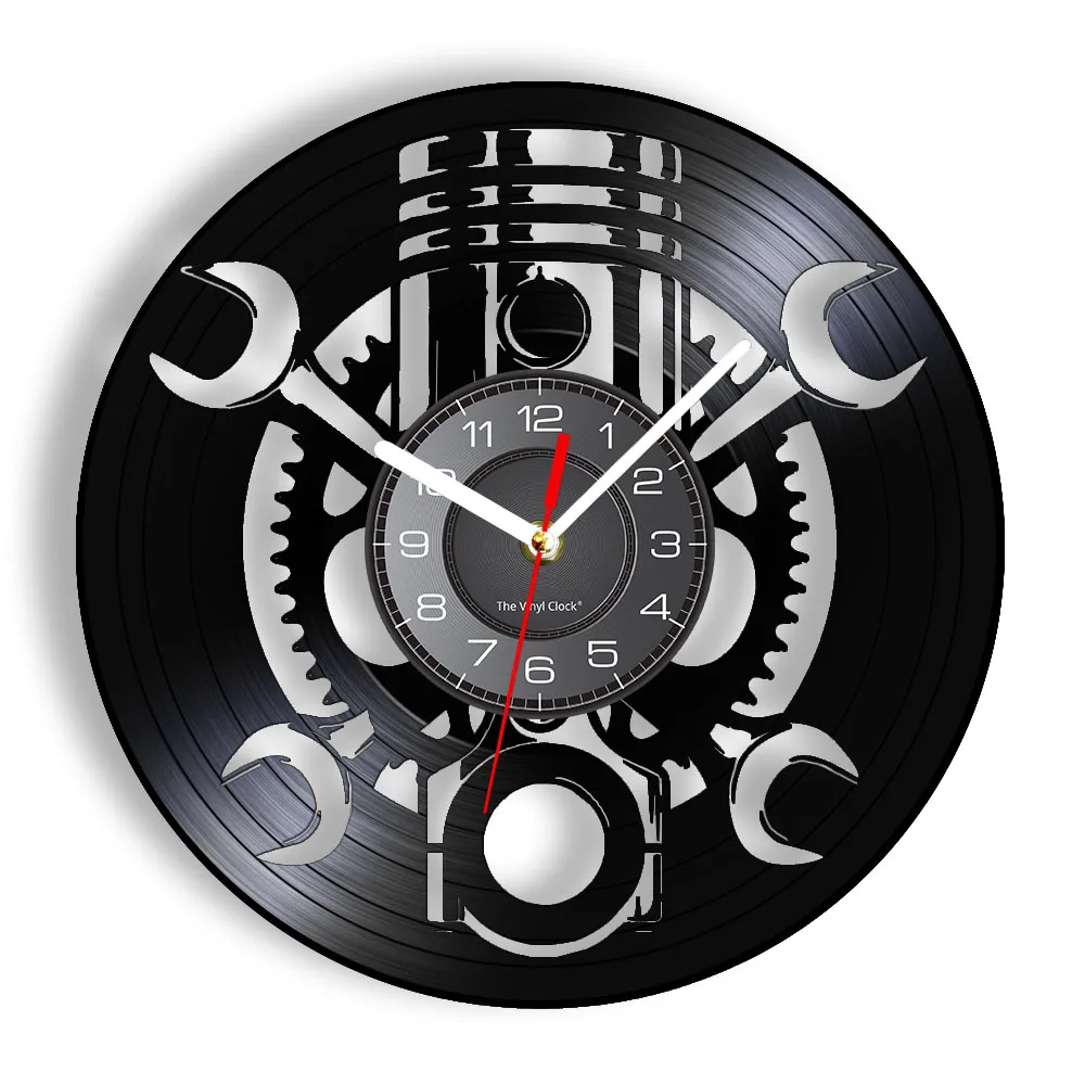 This Black Record Wall Clock showcases a rustic industrial design with intricate gear and wrench cut-outs crafted from a vinyl record.