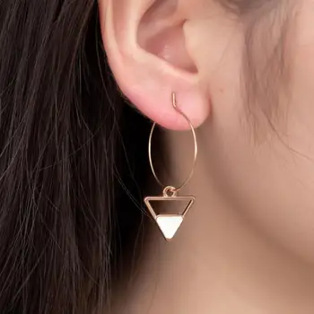 

Hot New Korean Fashion White Geometric Natural Mini Triangle Temperament Wild Design Temperament Ladies Earrings Wholesale