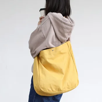 

Simple literary canvas bag wild large-capacity shoulder messenger bag leisure college wind hit color ribbon female bag