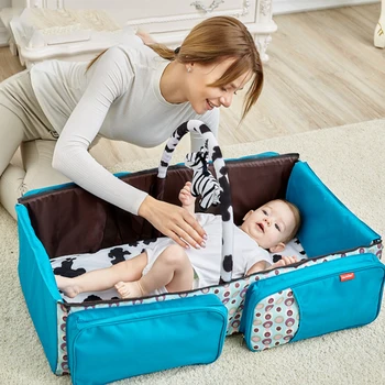 

Multifunctional folding crib with mosquito net and large capacity mummy bag