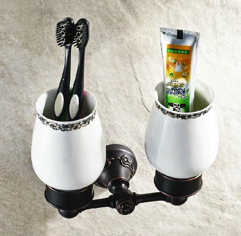 A bronze bath article rubbed with towel rack oil. Toilet paper holder. Soap holder. Towel holder. Bathroom holder