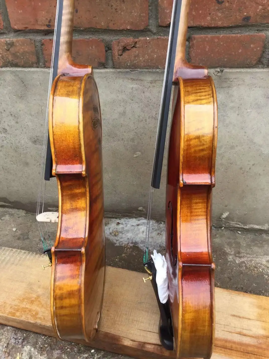 TWO VIOLINS 4/4 size maple back with hand crabed words old spruce top