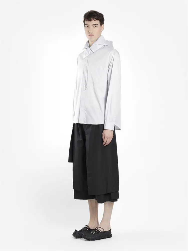 The new men\'s cropped trousers are dark and large size loose trousers with irregular asymmetrical wide legs