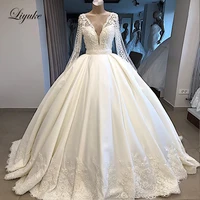 Liyuke Real Photos A Line Wedding Dress Ivory Satin Skirt Full Sleeve  Bling Bling Plearls Bridal Dress 1