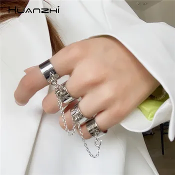 

HUANZHI 2020 New Punk Hip Hop Simple Chain Four Finger Silver Metal Adjustable Rotate Rings for Cool Guy Girls Jewelry
